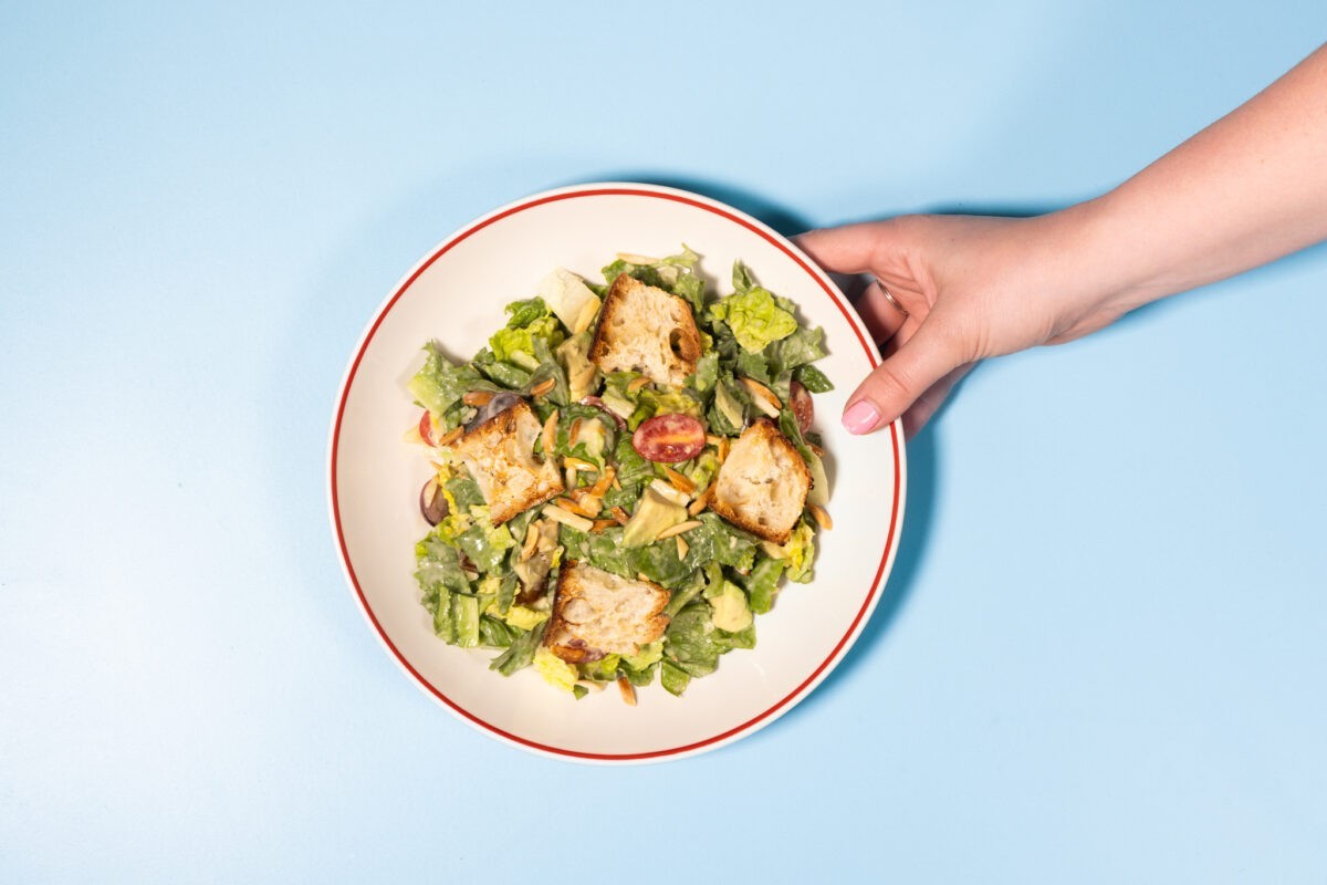 Founding Farmers’ Farmers Salad with mixed lettuce, avocado, grapes, tomatoes, dates, almonds, olives, and Parmigiano Reggiano.