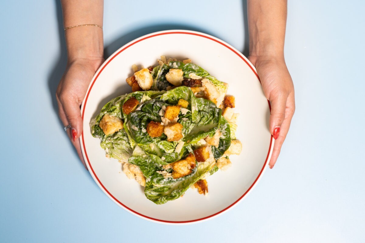 Founding Farmers’ Caesar Salad with little gem lettuce, biscuit and cornbread croutons, Parmigiano Reggiano, and Pecorino Romano.